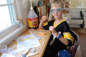 Read more about the article Gregory working on his Crystals