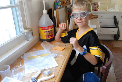 Read more about the article Gregory working on his Crystals