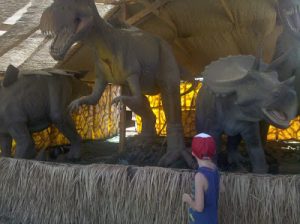 Read more about the article Adam looking at the robot dino!