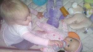 Read more about the article Little Grace feeding her baby